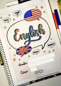 an open notebook with the word english written on it and various stickers around it