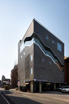 the building is made out of bricks and has an unusual design on it's side