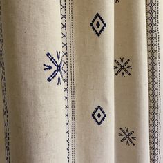 a curtain with blue and white designs on it