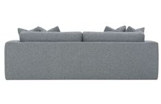 a gray couch with pillows on it