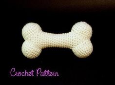 a crochet dog bone on a black background with the words crochet pattern below it