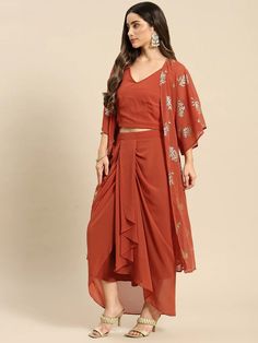 Look your absolute best as you head out this festive season wearing this Fusion Set. Crafted using the finest georgette fabric, this apparel will surely make you stand out. Complement this outfit with a pair of high-heels and chunky gold jewelry to complete your look. Material: Georgette Wash Care: Dry-clean Pattern: Printed Style: Crop Top With Dhoti Skirt Set, Crop Top With Dhoti Skirt And Jacket/Shrug Set, Dhoti Suit Set, Indo Western Dress, Indian Dress For Women Sizes: To Fit Bust(in inches Draped Georgette Sets For Party Wear, Summer Festive Lehenga With Traditional Drape, Designer Summer Party Wear Sets, Summer Party Wear Designer Sets, Festive Draped Party Sets, Party Palazzo Set With Unstitched Blouse And Traditional Drape, Festive Party Wear Palazzo Set In Georgette, Festive Party Wear Georgette Palazzo Set, Sheer Dupatta Sets For Summer Party