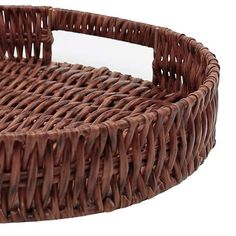 a brown wicker basket sitting on top of a white table