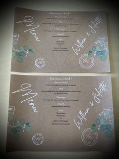 two brown wedding cards with white writing and flowers on the front, one in blue