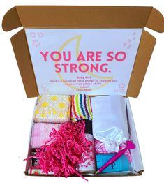 an open box with various items in it that says, you are so strong on the inside