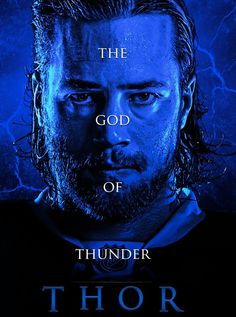 a man with long hair and beard standing in front of a blue background that says, the god of thunder