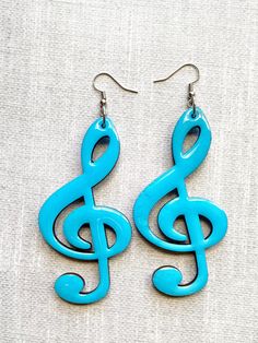 "Long Dangle Earrings for people who love music. Simple & lightweight, these earrings can be an easy \"grab and go\"  statement piece.  These super cute earrings measure 4\" long,  about 1 1/2\" wide and the ear hooks /clips are hypoallergenic.  Both sides are painted. You will receive 1 pair of sky-blue earrings with this listing.  *Because of the nature of wood, you will see some slight imperfections in the finish. **Please refer to the photos and note the length and width to be sure this size Gifts For Music Lovers, Treble Clef, Long Dangle Earrings, Love Music, Gift For Music Lover, Wood Earrings, Blue Earrings, Cute Earrings, Music Lovers