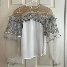 Reposhing Item. Never Worn. White Lace Top With Sheer Sleeves For Parties, White Chic Lace Top With Sheer Sleeves, Chic White Lace Top With Sheer Sleeves, Elegant Long Sleeve Mesh Top For Spring, Elegant Spring Mesh Top, Elegant Long Sleeve Mesh Top With Lace Trim, White Top With Sheer Sleeves For Workwear, White Tops With Sheer Sleeves For Work, White Sheer Sleeve Tops For Fall