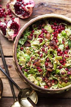 a bowl filled with shaved brussels sprouts and pomegranate