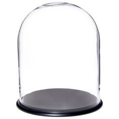 an empty glass dome on a black base