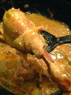 a close up of food being cooked in a skillet