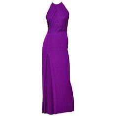 Galanos, purple, silk, crepe halter neck, evening gown with diagonally placed, pleating detail on the bodice. Skirt of gown has a deep inverted pleat on left side to allow for movement. Simple and elegant. Side slit to the right. Purple Halter Top, Purple Evening Gowns, Halter Neck Gown, Pleated Gown, Purple Gowns, Halter Gown, Women Formals, Halterneck Dress, White And Red