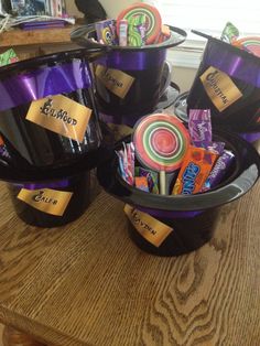 three black buckets filled with candy and candies