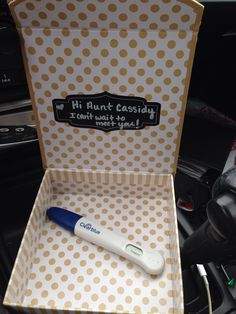 an electric toothbrush in a polka dot box