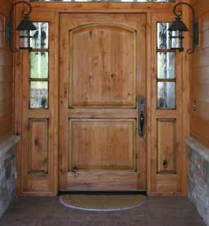 a wooden door with two glass panes on the front and side doors are shown