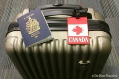 a suitcase with a canadian passport and a canadian flag tag on the top of it