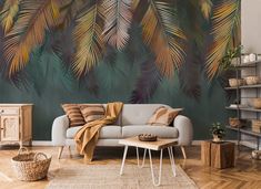 a living room scene with focus on the couch and wall mural