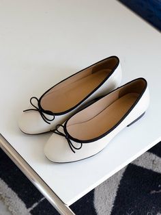 Editor's NotesNONETHELESS's simple and casual shoes will stand out your daily outlook.- Lovely ribbon point - Cute round shaped toe- Feminine and classic silhouette- Soft and durable leather textureMeasurements(in.)- Size: KR 220MM (US 5) - KR 255MM (US 8.5)- Heel Height: 0.39 in.*Fits true to the size.Composition & Care- Lambskin- Do not wash- Professional shoe cleaning is neededDesigner- by NONETHELESS White Elegant Ballet Flats For Everyday, White Classic Ballet Flats, Classic White Pointed Toe Ballet Flats, White Round Toe Flats For Everyday, White Round Toe Flats, Classic White Low Heel Ballet Flats, Classic White Ballet Flats With Low Heel, White Low Heel Ballet Flats For Work, White Ballet Flats For Work With Low Heel