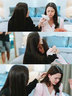 two women are doing different things together in the same room and one woman is brushing her hair