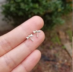 These sterling silver dragonfly earring studs are the perfect gift for that special someone in your life. Stylishly and minimalistic, they will never go out of style and can be worn everyday. Crafted with hypoallergenic nickel free sterling silver to suit any skin type, these small and dainty earrings are sure to be a showstopper. Every woman has a unique sense of style, and these earring studs will enhance it with their understated beauty. Finish: plain sterling silver or gold plated over sterl Dainty Sterling Silver Dragonfly Jewelry, Hypoallergenic Sterling Silver Dragonfly Jewelry, Silver Dragonfly Earrings For Gift, Silver Dragonfly Earrings Perfect For Gifts, Sterling Silver Dragonfly Earrings, Silver Sterling Dragonfly Earrings, Nickel-free Sterling Silver Dragonfly Earrings, Nickel-free Dragonfly Sterling Silver Earrings, Hypoallergenic Dragonfly Earrings As A Gift