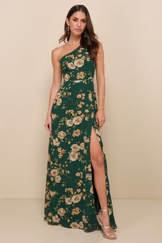 a woman wearing a green floral print one shoulder dress with thigh high slit and side split