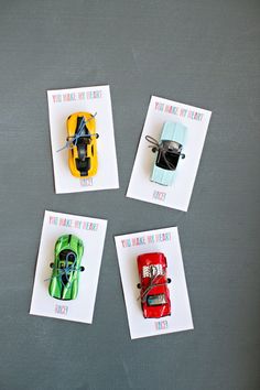 four small cards with cars on them