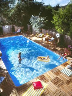 people are playing in the backyard pool