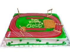 a birthday cake with a track on it