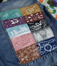 the back of a jean jacket with different designs on it