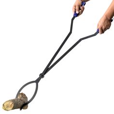 a person using a long handled garden tool