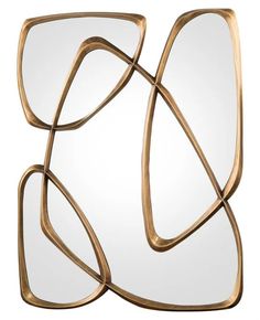 an abstractly designed mirror with gold metal frame and curved design on the front, against a white background