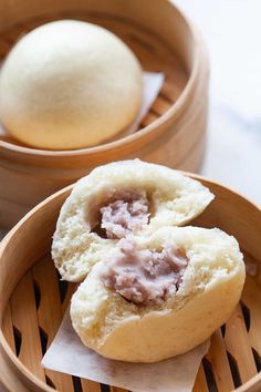 two small pastries in wooden bowls on a table