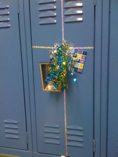 a bunch of lockers that have christmas decorations on them and some ribbons tied to the doors