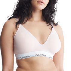 With a sleek design and iconic Calvin Klein branding, this soft, lightly lined women's bralette is the definition of effortless. Made with a soft cotton blend, this women's triangle bra offers all day comfort.Click on this INTIMATES & SLEEPWEAR Guide to find the perfect fit and more! Lightly lined cups Triangle silhouette Wireless Soft, cotton-blend modal construction Wide elasticized Calvin Klein logo band Lightweight, breathable feel Convertible shoulder straps Style no. QF7062FIT & SIZING Hook-and-eye closure 2 hook columns, 2 hook rowsFABRIC & CARE Cotton, modal, elastane Machine wash Imported Size: 2X. Color: Nymphs Thigh. Gender: female. Age Group: adult. Calvin Klein Bra, Cotton Bralette, Triangle Bralette, Plus Size Bra, Triangle Bra, Calvin Klein Woman, Sporty Look, Bra Women, Bra Lingerie