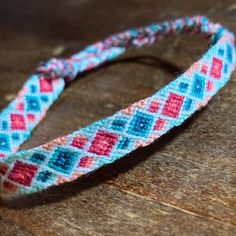 a close up of a headband on a wooden surface