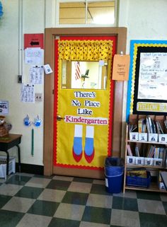 a classroom door decorated with posters and books