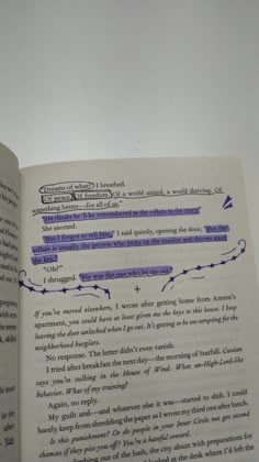 an open book with some writing on it's page and the pages are blue