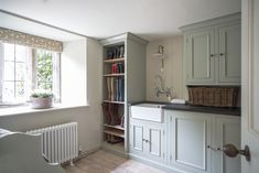 the kitchen is clean and ready to be used as a storage area for books or magazines