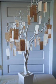 a white tree with lots of notes attached to it