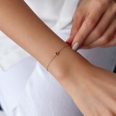 Our simple and elegant solitaire bracelet features a round cut natural ruby at its center. We can craft this bracelet in 14K or 18K Gold according to your preference.★ Bracelet Features• Gold Kt: 14K/18K Solid Gold (All pieces are stamped for authenticity)• Available Gold Colors: Yellow Gold, Rose Gold, White Gold• Center Round Cut Ruby Weight: 0.15 carat• We only work with real natural rubies• We offer a signed certificate with each bracelet for the authenticity of the center ruby stone.• Cente Solitaire Bracelet, Royalty Fashion, Solid Gold Bracelet, Ruby Bracelet, Rose Gold White, Gold Colors, Fancy Jewellery, Ruby Stone, Ruby Jewelry