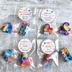 four bags filled with different types of candies