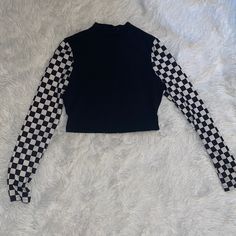 Purchased About 2 Years Ago But Never Worn Personally By Me. Unique Checkered Print Pattern Down Sleeves While The Rest Of The Top Is A True Black! Cropped Length, Size Medium, Mockneck Opening On Top. Perfect For Anybody Who Still Rocks This Type Of Style! Send Offers! Will Accept Reasonable Offers :) I Usually Ship The Next Day, 2 Days At Most! Trendy Black Mock Neck Top For Fall, Fitted High Neck Cotton Top, Trendy High Neck Top, Black Stretch Top With Patchwork, Black Stretch Patchwork Top, Trendy Stretch Patchwork Tops, Fitted Patchwork Top With Crew Neck, Fitted Patchwork Crew Neck Top, Stretch Black Patchwork Tops