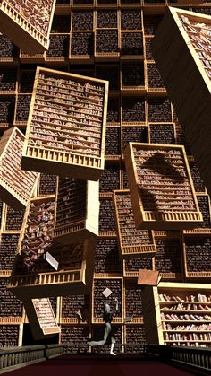 a person walking in front of a large stack of books