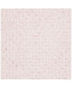 a white and pink rug with small squares on it