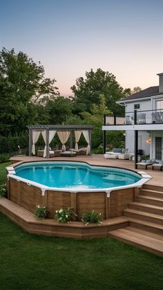 an above ground pool with steps leading up to it and a deck in the background