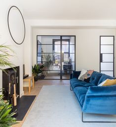 a living room filled with furniture and a fire place