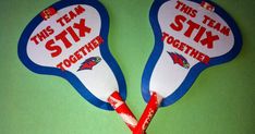 two red, white and blue toothbrushes with the words team stix together