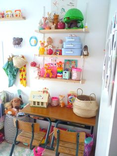 a child's play room with toys on the shelves