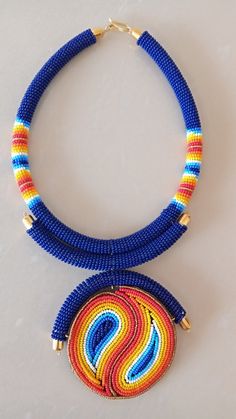 African Necklace, African Jewelry, African Beaded Necklace, Zulu Beaded Necklace, Dark Blue Necklace, Pendant Necklace, Gift For HerThis stunning pendant necklace is superbly crafted which makes you stands out in any occasion.Main Color - Dark Blue or Royal Blue.Different colors of your choice can be available.Wholesale available at a fair price.For any query please send me a convo or an e-mail.Happy Shopping!!! Unique Blue Beaded Necklaces, Unique Blue Beaded Chain Necklace, Unique Blue Beaded Necklace, Blue Beaded Necklaces With Spacer Beads, Blue Beaded Round Necklaces, Blue Beaded Necklaces With Colorful Beads, Blue Round Beaded Necklaces With Colorful Beads, Unique Blue Necklaces With Spacer Beads, Dark Blue Necklace