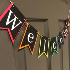 a welcome banner hanging on the front door